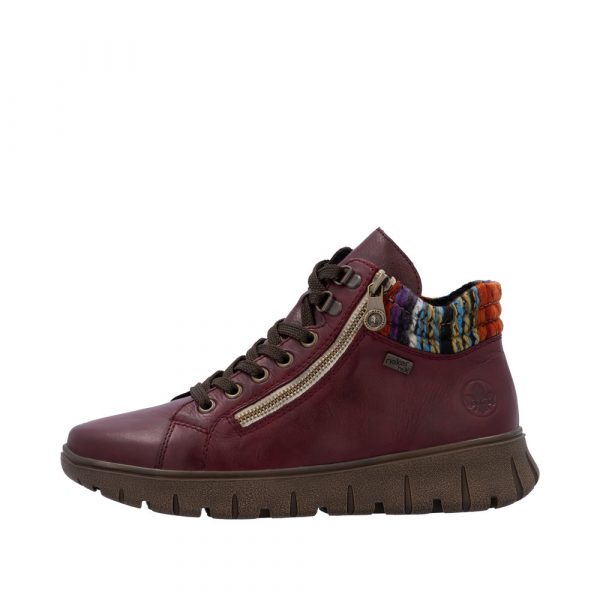 Baskets femme Cuir souple Imperméable Semelle épaisse Chaussant large Empiècement multicolore RIEKER N1305-35 coloris bordeaux. Vue du côté extérieur d'une chaussure gauche faisant apparaître la mention "tex" ainsi que le logo de la marque.