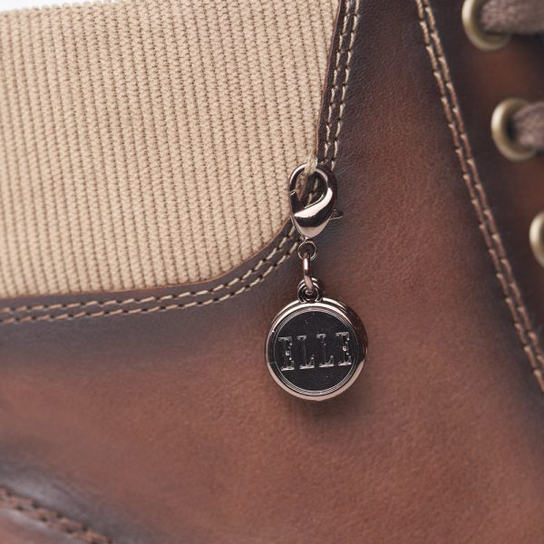 Boots cuir femme à lacets+ zip petit talon doublure chaude REMONTE coloris marron nuancé. Détail : médaille métallique.