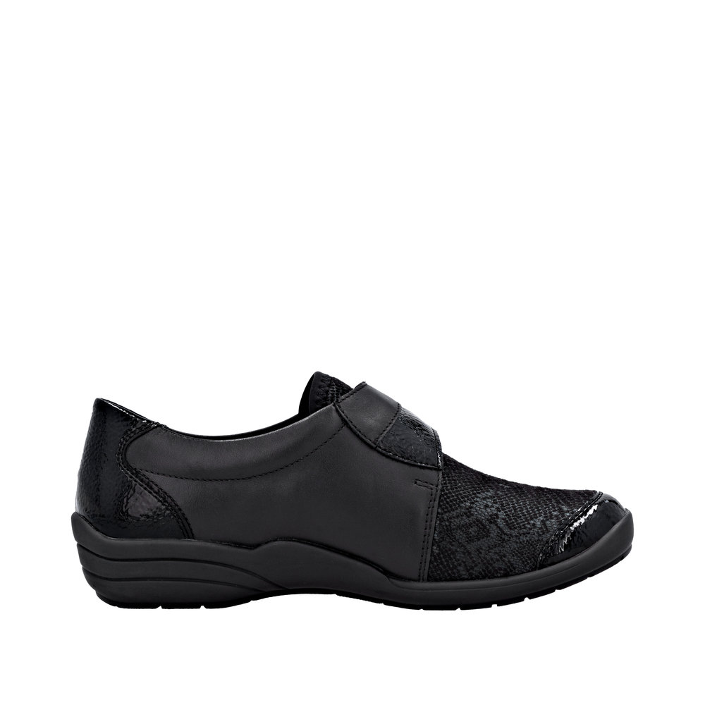 Chaussure basse confort Légère femme Velcro Semelle compensée Souple Stretch REMONTE R7600 coloris noir multi/vernis noir. Vue du profil intérieur d'une chaussure gauche montrant la forme de la semelle.