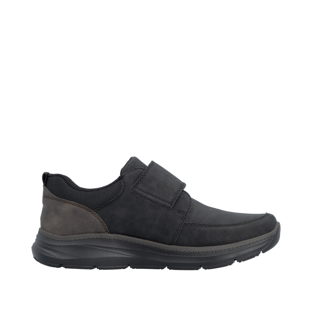 Chaussure basse homme Scratch Semelle souple Sneakers Simili cuir RIEKER B1854 Coloris noir. Vue du côté intérieur d'une tennis gauche montrant la forme de la semelle épaisse.